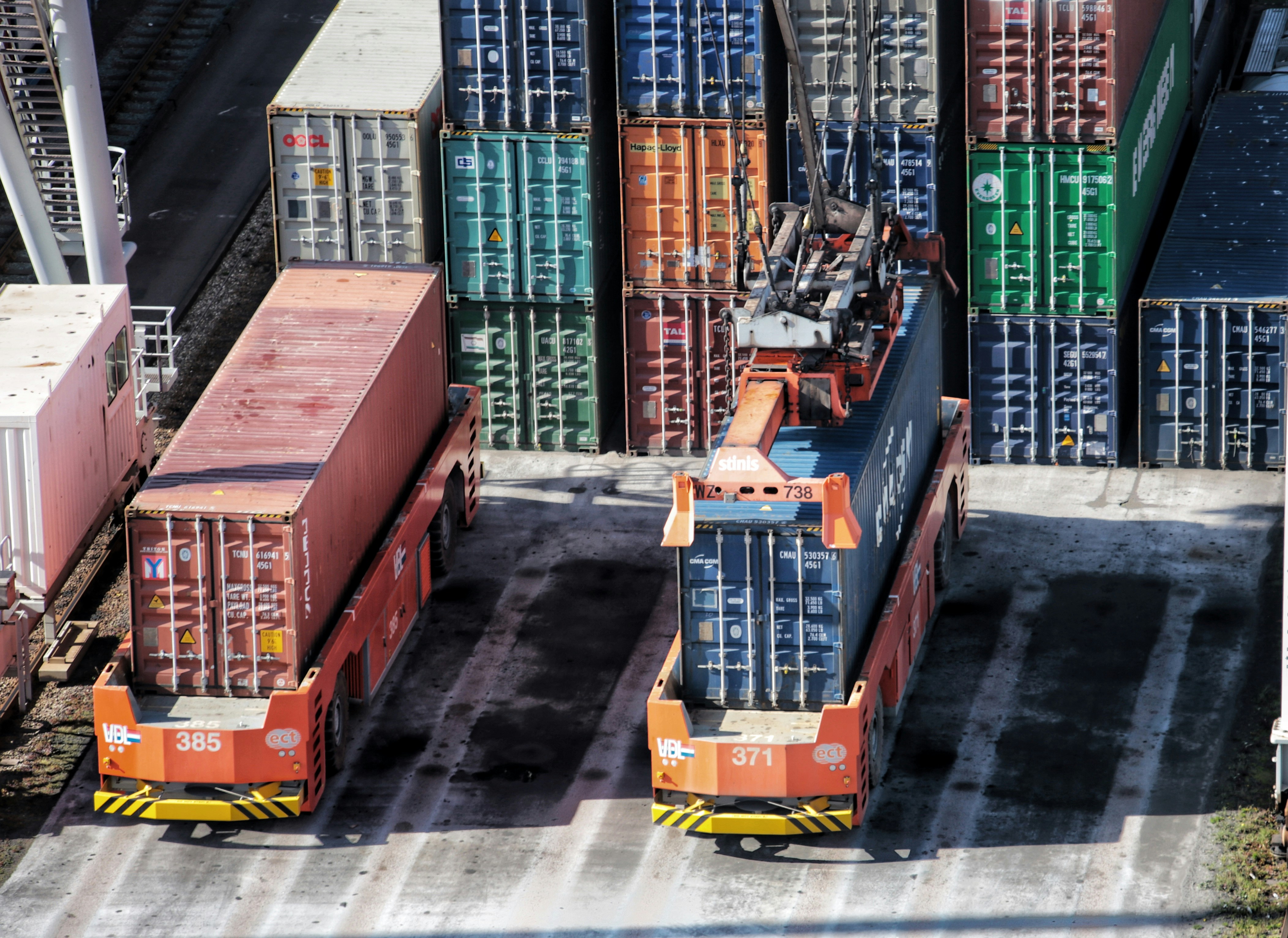 cargo containers are stacked on top of each other